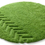 grass with tractor tire mark area rug