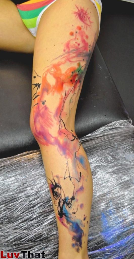 abstract watercolor large leg tattoo