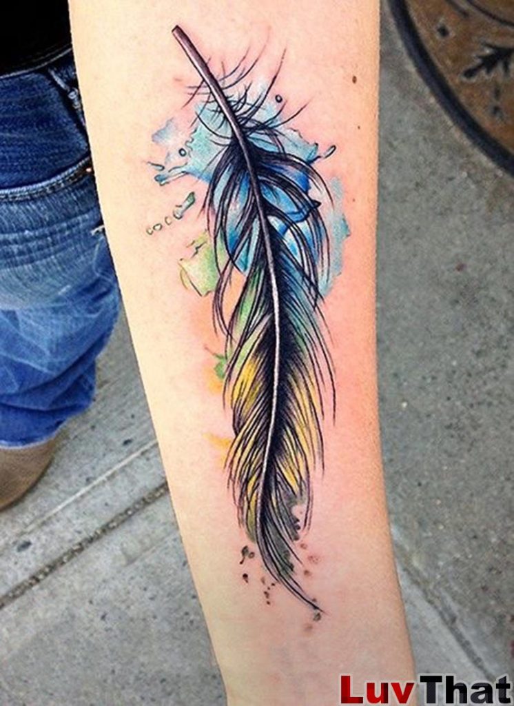 watercolor style feather tattoo on forearm