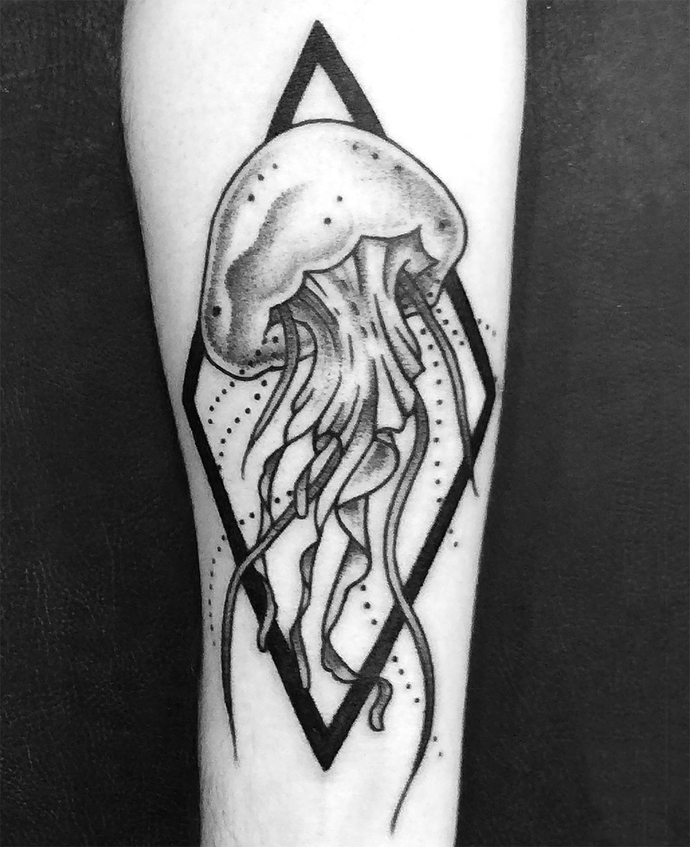 jellyfish tattoo breaking out of a diamond shape